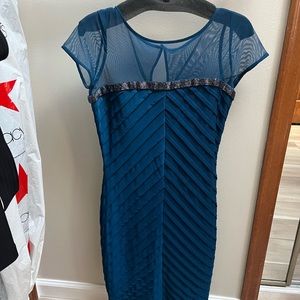 Calvin Klein fitted blue green/ teal fitted dress with mesh neckline and sleeves